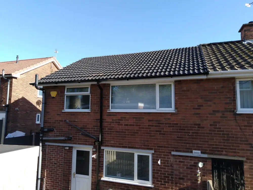 A finished re-roof with new guttering